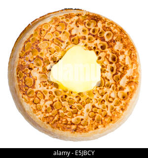 Toasted crumpet cut out or isolated against a white background. Stock Photo