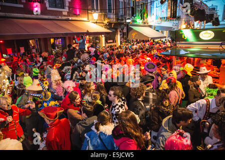 Netherlands, Maastricht, Carnival festival. Women singing and dancing. Twilight Stock Photo