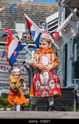 Netherlands, Marken, Children dressed in traditional costume on Kingsday, 27 April Stock Photo