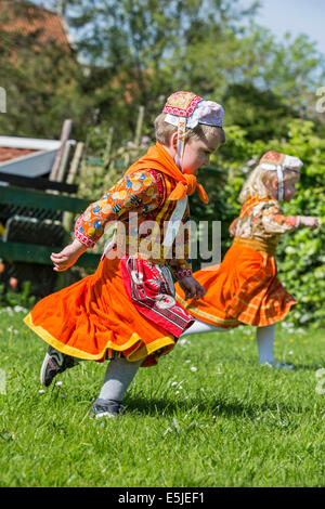 Netherlands, Marken, Children dressed in traditional costume on Kingsday, 27 April Stock Photo