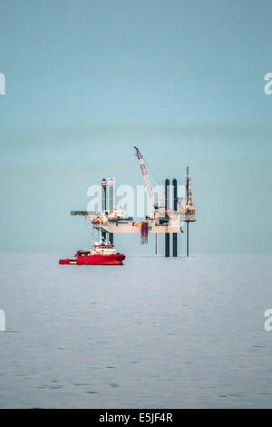 Netherlands, Den Helder, Dutch economic zone on North Sea. Offshore drilling platform SWIFT 10. Foreground offshore supply ship