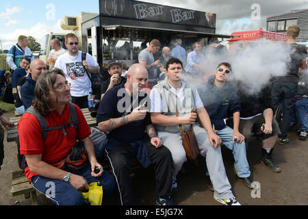 Vaping enthusiasts exhale from their e cigarettes at annual Vapour Festival 2014. Credit:  David Bagnall Stock Photo