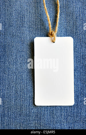 Price tag over jeans background, place your own text here Stock Photo
