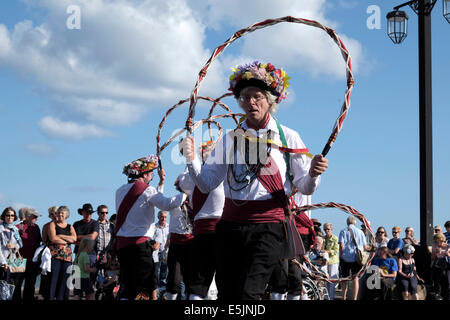 Sidmouth , Devon, UK. 2nd Aug 2014. Rose and Castle Morris dancers performing at the 60th Sidmouth Folk Festival till 8th August. Credit:  dPAD/Alamy Live News Stock Photo