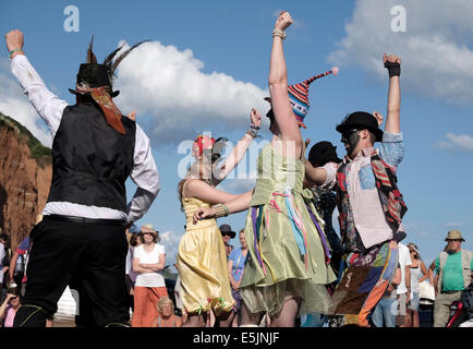 Sidmouth , Devon, UK. 2nd Aug 2014. The Ouse Washes Molly Dancers performing at the 60th Sidmouth Folk Festival till 8th August. Credit:  dPAD/Alamy Live News Stock Photo