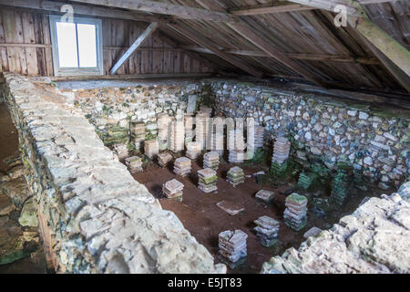 Excavated remains of a Hypocaust, an ancient underfloor heating system, preserved at Brading Roman Villa, Isle of Wight, southern England, UK Stock Photo