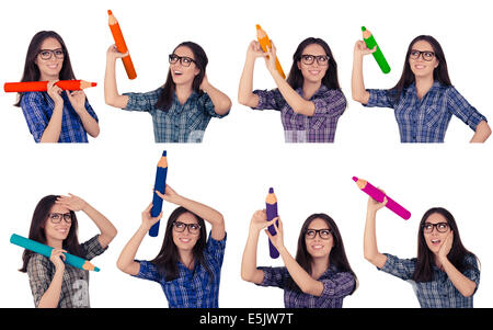 Girl with Glasses Holding Giant Pencils in Multiple Colors Stock Photo