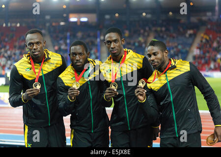 Hampden Park, Glasgow, Scotland, UK, Saturday, 2nd August, 2014. Glasgow 2014 Commonwealth Games, Men's 4 x 100m Relay, Medal Ceremony. Left to Right. Usain Bolt, Nickel Ashmeade, Kemar Bailey-Cole, Jason Livermore, Jamaica, Gold Medal Stock Photo