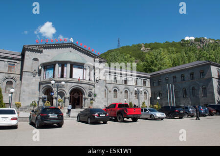 Cars line up outside a grand hotel building in Jermuk, Armenia, Armenia Stock Photo