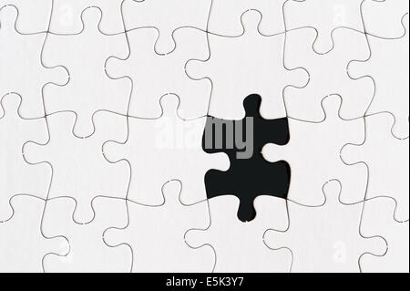 blank jigsaw puzzle with one missing piece Stock Photo