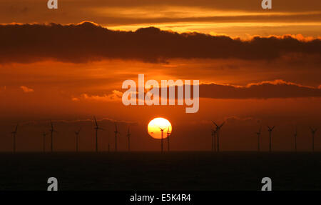 Sunrise over the North Hoyle Offshore Wind Farm off the coast of North Wales during spring 2014 Stock Photo