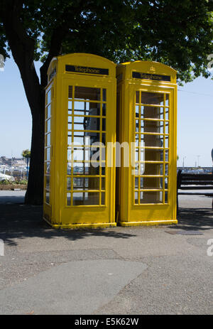Two yellow telephone boxes in St Peter's Port, Guernsey Stock Photo