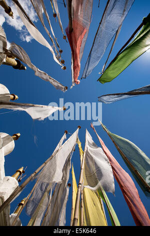 Eastern Bhutan, Lhuentse Valley Autsho, colourful tall Buddhist prayer flags in wind Stock Photo