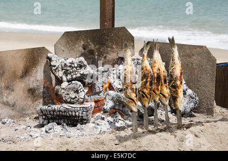 Fresh fish BBQ on a Beach outside a restaurant in La Cala De Mijas, Costa Del Sol, Malaga, Spain Stock Photo