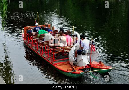 BOSTON, MASSACHUSETTS:  People enjoying a ride on one of the famed Swan Boats in the Boston Public Garden Stock Photo