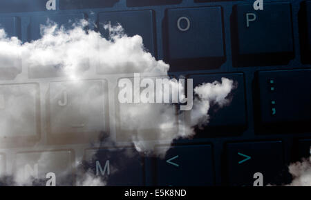 cloud computing. A keyboard over a cloud representing the concept of cloud computing or cloud internet suppliers Stock Photo