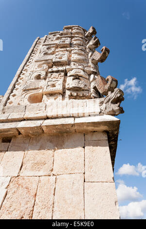 Detail of a corner in the Nunnery Quadrangle at Uxmal from below. The rich carving of the corner of  the building. Stock Photo