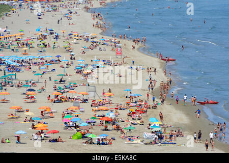 Aerial view of people enjoying long sandy beach along the Adriatic coastline on a hot summer day Stock Photo