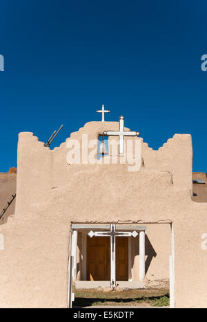 Old Mission church with three crosses and a bell Stock Photo