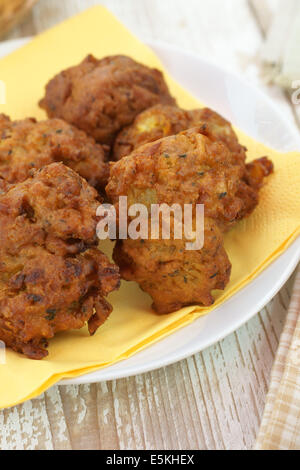 Onion Bhajji or bhaji is a spicy Indian snack of chopped onions fried in dough Stock Photo