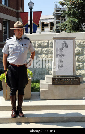 A Mountie at the Honour Roll at the Royal Canadian Mounted Police (RCMP) Depot in Regina, Saskatchewan. Stock Photo