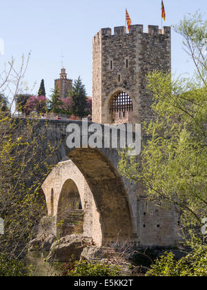 The fortified tower on the bridge into Besalu. The tower on the fortified stone bridge that connects this small medieval village Stock Photo