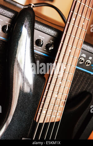 Five string bass guitar with combo amplifier Stock Photo