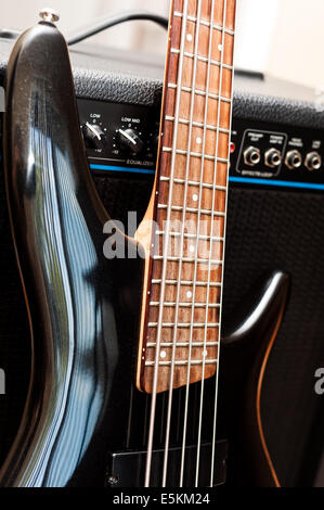 Five string bass guitar with combo amplifier Stock Photo