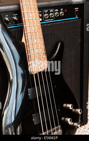 Five string bass guitar with combo amplifier Stock Photo