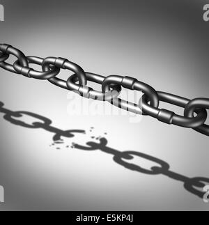 Link breaking and broken chain business concept as iron chains casting a shadow of a broken connection as a metaphor for freedom and the dreams and hopes of breaking out for success. Stock Photo