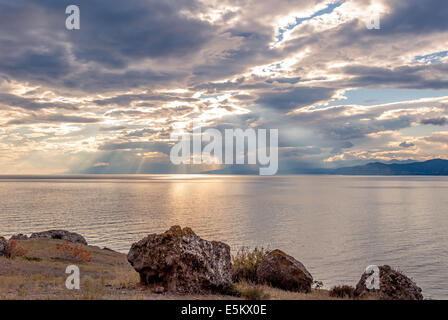 Sunset sky on the rocky coast of the Black Sea in Crimea Stock Photo