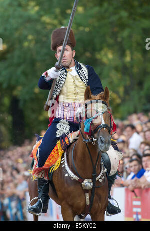 Sinj, Croatia. 3rd Aug, 2014. A horseman wearing traditional knight costume competes during the 299th Sinjska Alka competition in the town of Sinj, southern Croatia, August 3, 2014. The Sinjska Alka is an equestrian competition held every year since 1715 commemorating the victory over Ottoman Turkish army. Sinjska Alka is part of UNESCO's Intangible Cultural Heritage List since 2010. Credit:  Miso Lisanin/Xinhua/Alamy Live News Stock Photo