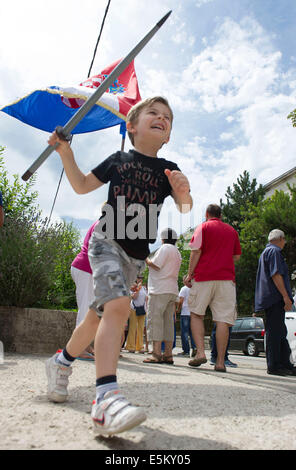 Sinj, Croatia. 3rd Aug, 2014. A boy plays with short lance during the 299th Sinjska Alka competition in the town of Sinj, southern Croatia, August 3, 2014. The Sinjska alka is an equestrian competition held every year since 1715 commemorating the victory over Ottoman Turkish army. Sinjska Alka is part of UNESCO's Intangible Cultural Heritage List since 2010. Credit:  Miso Lisanin/Xinhua/Alamy Live News Stock Photo