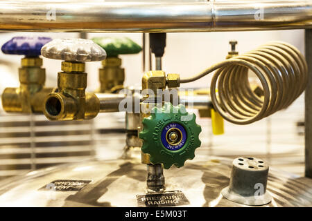 A pressure valve on top of a cylinder of gas in a science research laboratory. Stock Photo