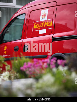 A Royal Mail delivery van parked outside the Royal British Legion in Old Basing, Hampshire, UK Stock Photo