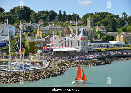 Spectators on shore and around the Royal Yacht Squadron during Cowes Week, Cowes, Isle of Wight, UK, England Stock Photo