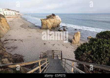 Public access stairs leading down to hidden cove on Malibu's affluent northern shore. Stock Photo