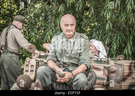 TEKOV, SLOVAKIA - JULY 26,2014: German lieutenant on a pause during reenactment of World War II fights in Slovakia Stock Photo