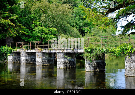 Abbey Footbridge  a stone structure with iron railings over the River Cong, Cong, County Mayo, Ireland Stock Photo