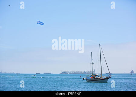 Banner Towing Over Long Beach Harbor. Stock Photo