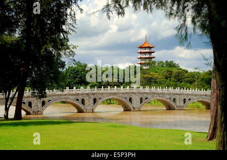 SINGAPORE:  Marble bridge connects the Chinese and Japanese Gardens with the grand pagoda in the distance Stock Photo