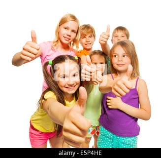 Portrait of six kids showing thumbs up Stock Photo