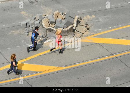 Toronto, Ontario, Canada. 4th Aug, 2014. On the movie set at 909 Bay Street in Toronto. 'Pixels' is an upcoming 2015 American 3D live-action/computer-animated film produced by Columbia Pictures and Happy Madison Productions. The film is directed by CHRIS COLUMBUS from a screenplay written by Tim Herlihy and Timothy Dowling. Main actors: ADAM SANDLER, KEVIN JAMES, JOSH GAD, PETER DINKLAGE, MICHELLE MONAGHAN, BRIAN COX, ASHLEY BENSON, and JANE KRAKOWSKI. Credit:  ZUMA Press, Inc./Alamy Live News Stock Photo