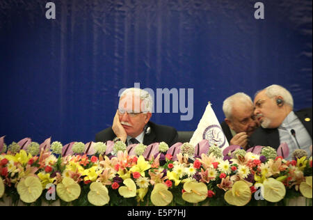 Tehran, Iran. 4th Aug, 2014. Palestinian Foreign Minister Riyad al-Maliki (L) attends an emergency meeting of Palestine Committee of the Non-Aligned Movement (NAM) in Tehran, Iran, on Aug. 4, 2014. The NAM's one-day emergency meeting opened here on Monday. Credit:  Ahmad Halabisaz/Xinhua/Alamy Live News Stock Photo