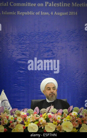 Tehran, Iran. 4th Aug, 2014. Iranian President Hassan Rouhani attends an emergency meeting of Palestine Committee of the Non-Aligned Movement (NAM) in Tehran, Iran, on Aug. 4, 2014. The NAM's one-day emergency meeting opened here on Monday. Credit:  Ahmad Halabisaz/Xinhua/Alamy Live News Stock Photo