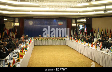 Tehran, Iran. 4th Aug, 2014. Diplomat officials attend an emergency meeting of Palestine Committee of the Non-Aligned Movement (NAM) in Tehran, Iran, on Aug. 4, 2014. The NAM's one-day emergency meeting opened here on Monday. Credit:  Ahmad Halabisaz/Xinhua/Alamy Live News Stock Photo