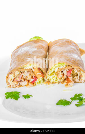 rolled pancakes stuffed with ham and cheese; stuffed crepes with ham and cheese filling Stock Photo