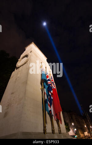 London, UK. 4th Aug, 2014.The Cenotaph remains illuminated as a  shaft of light rises from behind the Houses of Parliament, as Britain remembers the outbreak of World War 1 a century ago. Credit:  Paul Davey/Alamy Live News Stock Photo