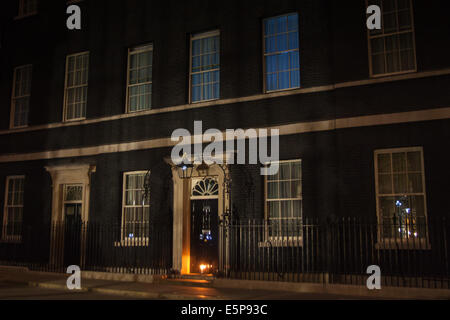 London, UK. 4th Aug, 2014. A single candle illuminates the door of 10 Downing Street as the UK commemorates the centeanary of the outbreak of World War 1. Credit:  Paul Davey/Alamy Live News Stock Photo