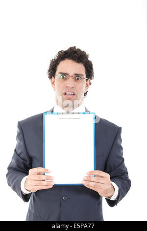 confused and stunned young businessman posing with white board or blank notes Stock Photo